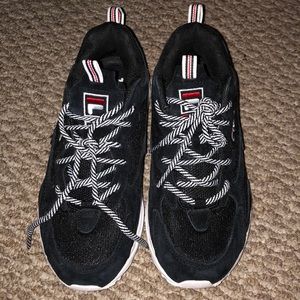 Black and white Fila tennis shoes